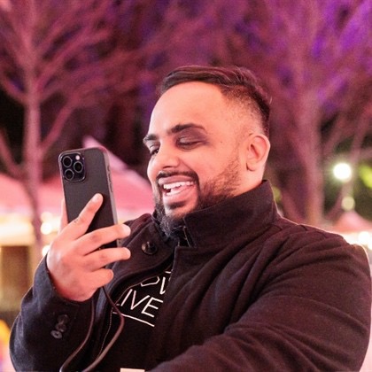 Sumeet Joseph creating content on his phone